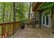 Outdoor deck with lounge chairs surrounded by trees, providing a serene and private setting at 403 S River Farm Dr, Alpharetta, GA 30022