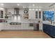 Well-lit kitchen featuring stainless steel appliances and ample counter space at 403 S River Farm Dr, Alpharetta, GA 30022