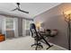 Comfortable office featuring modern ceiling fan, natural light from windows and a stylish black desk at 403 S River Farm Dr, Alpharetta, GA 30022