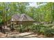 Community pool area surrounded by lush greenery, perfect for relaxation and recreation at 403 S River Farm Dr, Alpharetta, GA 30022