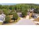 An aerial view showcases this community's lush greenery and well-maintained landscaping at 704 Williamsburg Ct, Villa Rica, GA 30180