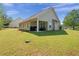 Spacious backyard featuring a covered patio perfect for outdoor entertaining at 704 Williamsburg Ct, Villa Rica, GA 30180