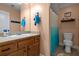 Bathroom features a single sink vanity and shower with a modern shower curtain at 704 Williamsburg Ct, Villa Rica, GA 30180