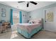 Bedroom features a ceiling fan, natural light, and book shelves at 704 Williamsburg Ct, Villa Rica, GA 30180