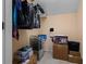 A small cluttered closet with wire shelving and filled with totes and boxes at 704 Williamsburg Ct, Villa Rica, GA 30180
