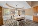 Dining area with large windows and classic decor at 704 Williamsburg Ct, Villa Rica, GA 30180