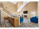 Open concept living room featuring vaulted ceilings, fireplace, and modern decor at 704 Williamsburg Ct, Villa Rica, GA 30180