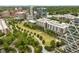 This aerial view showcases the area's lush landscaping, serene pond, walking paths, and nearby apartments at 830 Belgrade Ne Ave, Atlanta, GA 30306