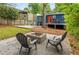 Backyard features an outdoor patio and seating near a fire pit at 830 Belgrade Ne Ave, Atlanta, GA 30306