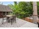 Backyard deck features a wood table with chairs and overlooking the green backyard at 830 Belgrade Ne Ave, Atlanta, GA 30306