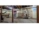Unfinished basement featuring sealed walls, concrete floor, and visible plumbing and electrical systems at 830 Belgrade Ne Ave, Atlanta, GA 30306