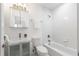 Bathroom features a tub and shower, tile flooring and subway tile backsplash at 830 Belgrade Ne Ave, Atlanta, GA 30306