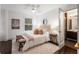 Bright bedroom with hardwood floors, lots of light, and access to an adjacent modern bathroom at 830 Belgrade Ne Ave, Atlanta, GA 30306
