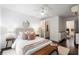 Comfortable bedroom with bench, ceiling fan, modern lighting, and ensuite bathroom access for convenience at 830 Belgrade Ne Ave, Atlanta, GA 30306