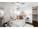 Bedroom features an ensuite bathroom, hardwood floors, closet and a ceiling fan at 830 Belgrade Ne Ave, Atlanta, GA 30306