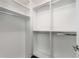Walk-in closet with shelves and hanging rods at 830 Belgrade Ne Ave, Atlanta, GA 30306