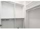 Well-organized closet featuring a spacious interior with built-in shelving and rods at 830 Belgrade Ne Ave, Atlanta, GA 30306