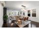 Elegant dining area featuring hardwood floors, modern lighting, and seamlessly connects to the bright living space at 830 Belgrade Ne Ave, Atlanta, GA 30306