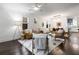 Bright and airy living room showcases stylish decor, hardwood floors, and seamlessly integrates with the dining area at 830 Belgrade Ne Ave, Atlanta, GA 30306