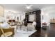 Open-concept living space with modern decor, hardwood floors, and bright natural light from ample windows at 830 Belgrade Ne Ave, Atlanta, GA 30306