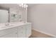 Bright bathroom featuring double sinks, a large mirror, and wood-look tile flooring at 1344 Riverstone Rd # 108, Jonesboro, GA 30238