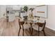 Open-concept kitchen and dining area with stylish furnishings and modern design at 1344 Riverstone Rd # 108, Jonesboro, GA 30238