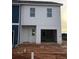 Charming home exterior featuring white siding, an attached garage, and a welcoming entrance at 1344 Riverstone Rd # 108, Jonesboro, GA 30238