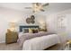 Bedroom featuring ceiling fan, neutral colors, decorative accents, and stylish furniture at 1344 Riverstone Rd # 108, Jonesboro, GA 30238