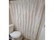 Bathroom with a toilet and white shower curtain at 2044 Mallard Crest, Lithonia, GA 30058