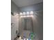 Bathroom featuring a vanity with a decorative mirror and modern lighting at 2044 Mallard Crest, Lithonia, GA 30058