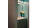 Powder room features a lovely vanity with storage, a framed mirror, and a decorative light fixture at 2044 Mallard Crest, Lithonia, GA 30058