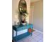 Stylish console table with decorative mirror and accents in the entryway at 2044 Mallard Crest, Lithonia, GA 30058