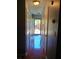 Hallway with glossy floors leading to the front door offers a warm welcome with natural light at 2044 Mallard Crest, Lithonia, GA 30058