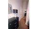 Hallway with black dresser and a decorative lamp with mirror decor throughout at 2044 Mallard Crest, Lithonia, GA 30058