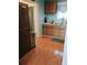 A functional kitchen featuring wood cabinets and tiled flooring provides a comfortable cooking space at 2044 Mallard Crest, Lithonia, GA 30058
