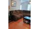Spacious living area with hardwood floors, side table and a large sectional sofa at 2044 Mallard Crest, Lithonia, GA 30058