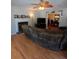Inviting living room featuring a fireplace, ceiling fan, and wood floors at 2044 Mallard Crest, Lithonia, GA 30058
