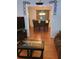Bright living room with hardwood floors, media center and dining room view at 2044 Mallard Crest, Lithonia, GA 30058