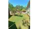 Charming side yard with vibrant flowering bushes adding color to the landscape at 2044 Mallard Crest, Lithonia, GA 30058