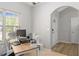 Home office featuring a wooden desk, large window, and neutral decor, offering a comfortable workspace at 395 Anvil Way, Austell, GA 30168