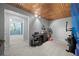 Finished basement area featuring decorative copper ceiling, neutral carpet, and access to a separate room at 4016 Upland Trce, Marietta, GA 30066