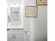 Clean bathroom with white vanity, a granite countertop, modern fixtures, and decorative art at 4016 Upland Trce, Marietta, GA 30066