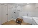 Modern bathroom with glass shower, free-standing tub, and sleek fixtures at 4016 Upland Trce, Marietta, GA 30066