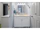 Fresh bathroom featuring white vanity, a modern countertop, stylish mirror, and new fixtures at 4016 Upland Trce, Marietta, GA 30066