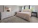 Comfortable bedroom featuring a queen-sized bed, large dresser, and multiple windows at 4016 Upland Trce, Marietta, GA 30066
