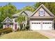 Charming two-story home with a well-manicured lawn and attached two-car garage at 4016 Upland Trce, Marietta, GA 30066