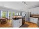 Bright kitchen featuring stainless steel appliances, a center island, and hardwood floors at 4016 Upland Trce, Marietta, GA 30066