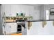 Updated kitchen with white cabinets, granite countertops, stainless steel appliances, and stylish backsplash at 4016 Upland Trce, Marietta, GA 30066
