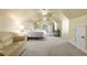 Spacious attic bedroom with multiple ceiling fans, creating a comfortable and functional living space at 895 Ovalene Sw Ln, Marietta, GA 30064