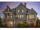 Stunning back exterior of the home, featuring a spacious deck and covered outdoor area at 895 Ovalene Sw Ln, Marietta, GA 30064